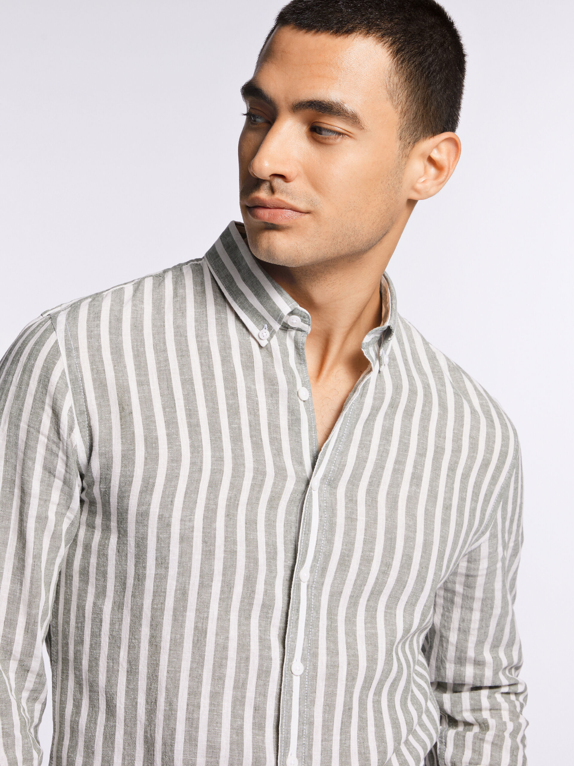 Model wearing a striped Lindbergh linen shirt