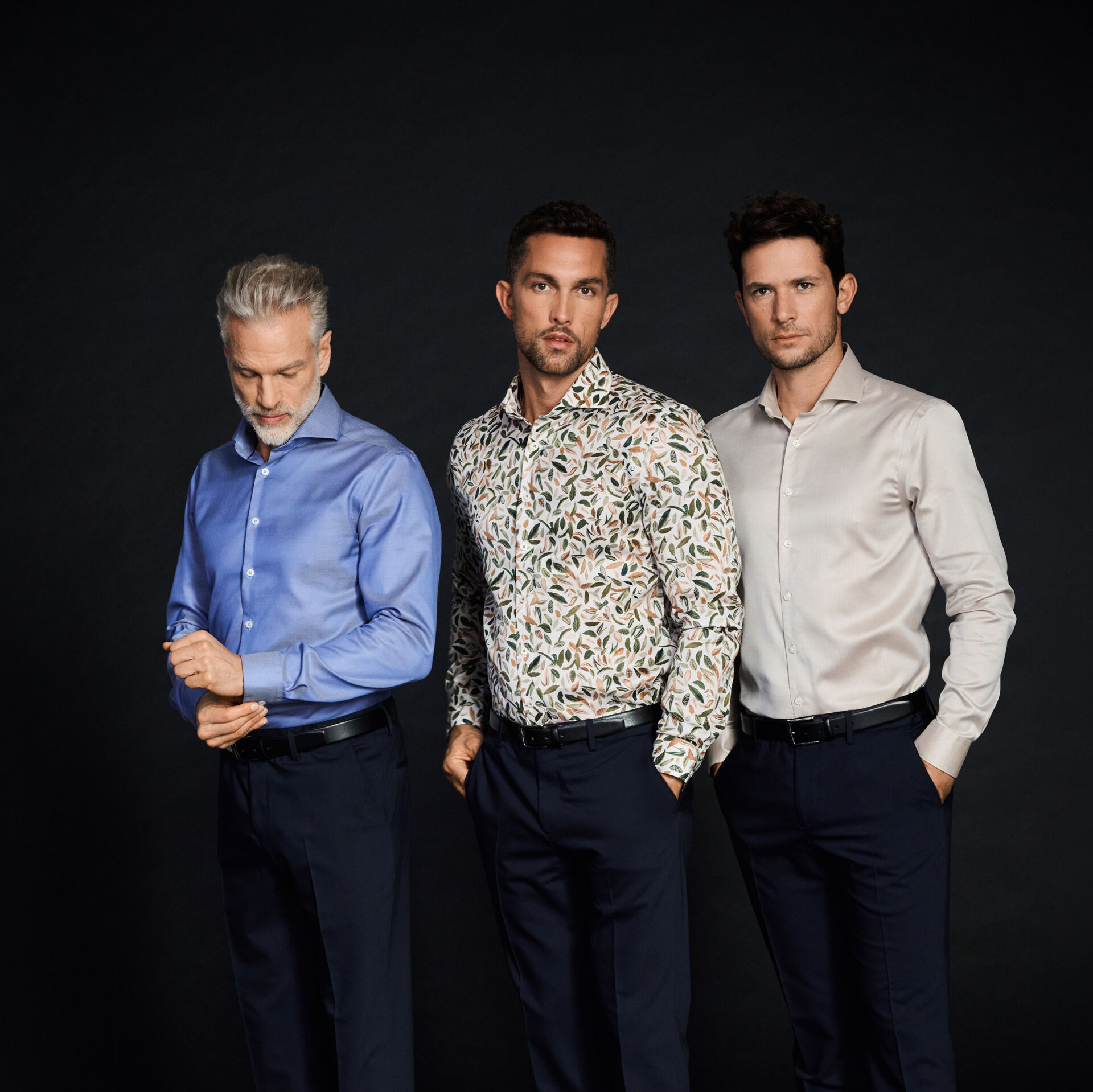 tre mænd i skjorter